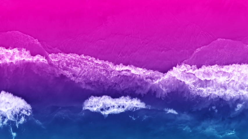 Bright colorful top view of the beach in ultraviolet neon color. Unusual combination of colors. Magical atmosphere. Aerial 4k view Royalty-Free Stock Footage #1050232222