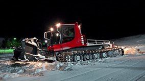 4K snowcat ratrac tractor cleaning snow outdoors, UHG steadycam stock video