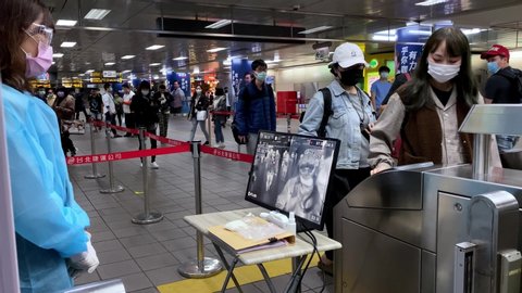 Taipei, Taiwan-21 March, 2020: 4K, Thermographic image. Thermal scanning in train station. Infrared thermal scanners for mass screening of travellers for influenza COVID 19. Corona virus outbreak.-Dan