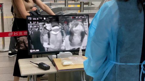 Taipei, Taiwan-21 March, 2020: 4K Thermal scanner detecting infected people with Covid-19 in train station. Infrared thermal scanners for the mass screening of travellers for coronavirus influenza-Dan