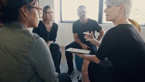 Businesswoman with a digital tablet conducting a team-building seminar in office. Corporate professionals engaged in personal development training program.
 - Powered by Shutterstock - Get 15% off with code: PIKWIZARD15