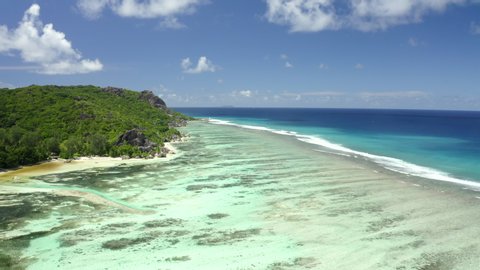 Dron view  Anse source d'argent azure sea water (Indian Ocean), La Digue, Seychelles islands vacation, UHD 4K part 1