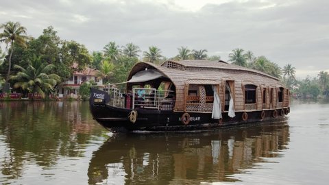 Alleppey, India - November 28, 2019: Traditional houseboat at beautiful backwaters in Alleppey, Kerala, India