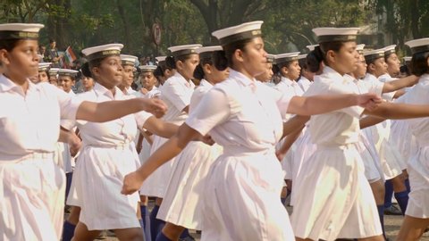 Slow motion shot of young female/ girls cadets/ scouts marching/ performing/ walking in uniform in parade during National/ Republic day Parade/ ceremony / celebration in Mumbai, India (January 2020)