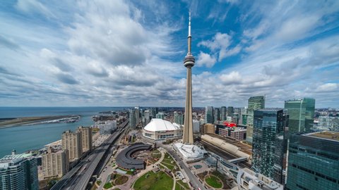 Toronto, Canada - April 09, 2020: Panoramic time lapse view of Toronto cityscape including architectural landmark CN Tower on a sunny day in Toronto, Ontario, Canada. 