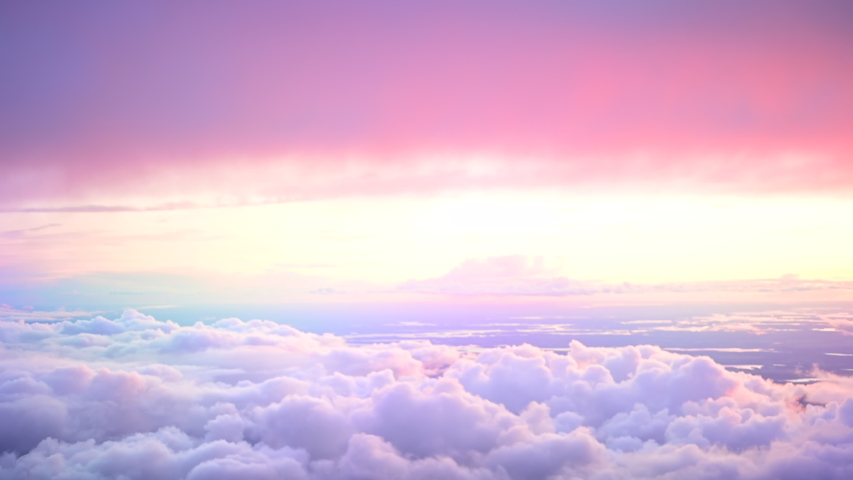 Beautiful colourful cloudscape. View over or above amazing heaven like clouds. Fluffy soft pink and purple fairy tale sunrise or sunset sky moving. Like paradise | Shutterstock HD Video #1050281725