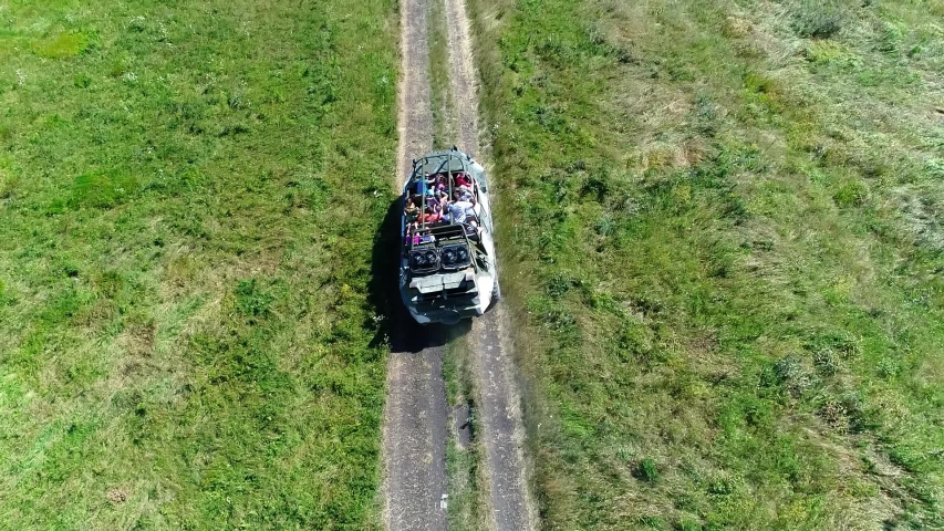 A military armored personnel carrier, converted into a tourist car, rides on a dirt road at the top of the markotkh range, the Caucasus mountains. The Resort Of Gelendzhik. Extreme tourist route