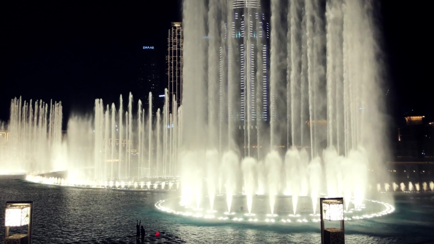 DUBAI,UAE-5 FEBRUARY,2020:Dancing fountains at Dubai Mall near Burj Khalifa.Footage of beautiful fountain performance at night in popular tourist area in United Arabic Emirates