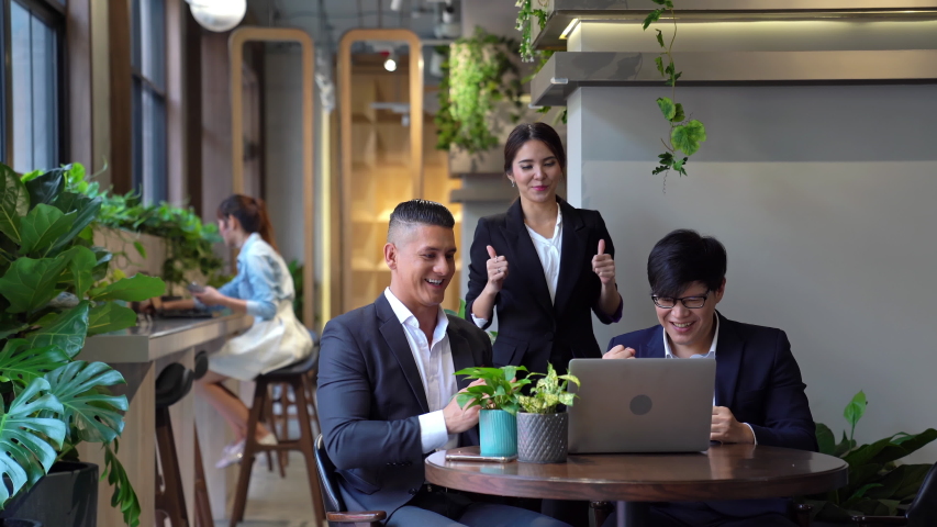 Successful business group and happiness in cafe at relax zone in co-working space. Royalty-Free Stock Footage #1050338887