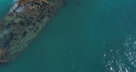 4k Aerial video of underwater ship wreck in beautiful green blue ocean 