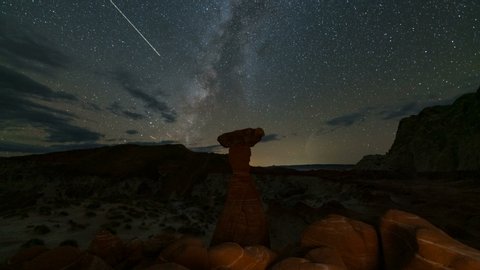 Time lapse tracking shot of Milky Way galaxy over Toadstool hoodoos in Grand Staircase Escalante National Monument in Utah
