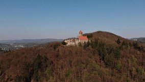 Beautiful evening flight over castle Wachenburg. The home of the German student corporations on Mount Wachenberg over the city of Weinheim. Germany.