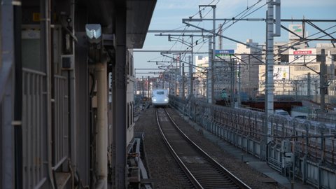 Nagoya, Aichi / Japan - February 19th 2020: Bullet train Shinkansen arrives at Nagoya Station. Head-on view.