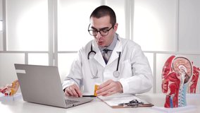 Medical Professional Doctor, video chatting with his patient using his laptop computer device, to explain how to use the medication and what side effects to expect.