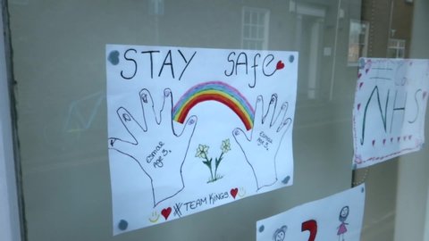 Thank you NHS kids drawings in shop window. Coronavirus pandemic lock down. Stay indoors, protect the NHS, save lives. Filmed East Yorkshire, England UK. 12/04/2020 