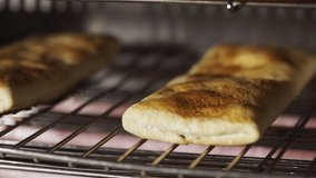 Puff pastry pies with meat baking in the oven