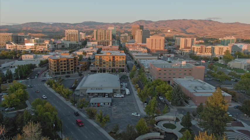 Aerial flying over downtown Boise at sunset. Boise, Idaho, USA. 