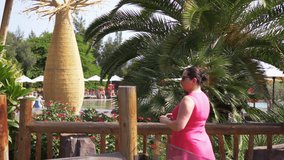 Woman taking picture on the vacation in 4k slow motion 60fps
