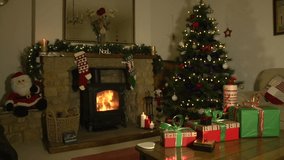 Christmas Lounge or Living Room Scene with Christmas Tree, Fireplace and Presents - Stock Video Clip Footage