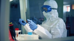 Female doctor work in laboratory, developing a vaccine. Coronavirus, COVID-19, 2019-ncov medicines research concept. - Powered by Shutterstock - Get 15% off with code: PIKWIZARD15