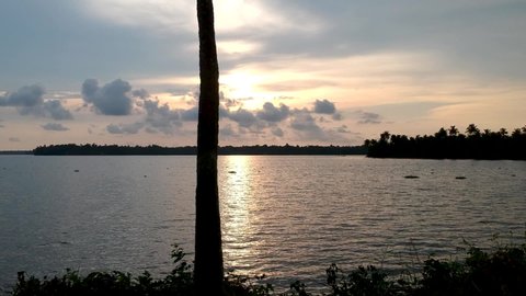 Backwaters sunset,Silhouette sunset in Vembanad lake,Sunset over Vembanad Lake