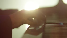 Footage of male hands playing grand piano . Man touches fingers on keys . Pianist plays in beautiful grand piano on stage in concert . Close up . Shot on ARRI ALEXA movie camera in slow motion . - Powered by Shutterstock - Get 15% off with code: PIKWIZARD15