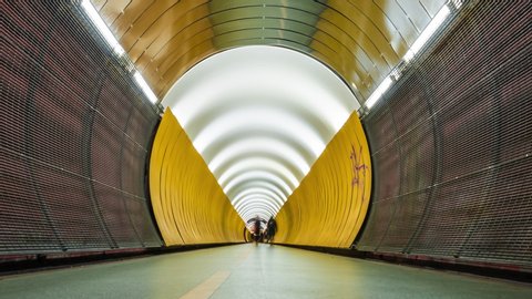 Stockholm, Sweden. Crowd of people walking through yellow Tunnel. Timelapse.