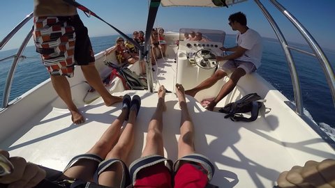 Brela - Croatia - 09-08-2019- Parasailing launch from deck of speed boat in Adriatic Sea boat crew helping point of view. Summer vacation Adriatic. Young couple