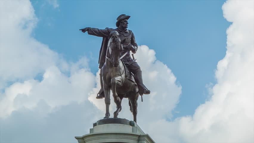 Sam Houston Monument Statue of Man and Horse Close-up with Detail and Blue Sky with White Clouds Background