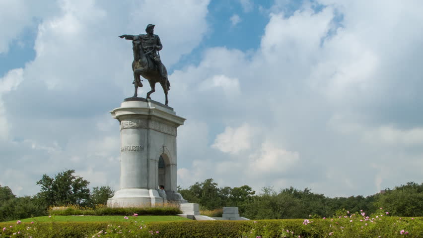 Sam Houston Monument Statue Wide Shot with Tourists Visiting the Gardens of Hermann Park on a Sunny Texas Day