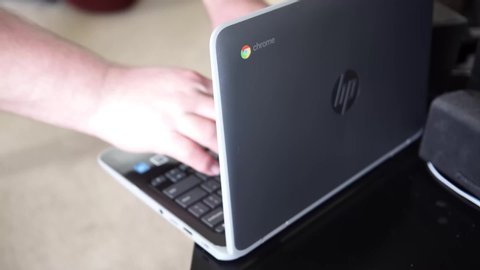 Elgin, IL - 04/14/2020: A Chromebook was sent home for student use during the Corona Virus Pandemic.