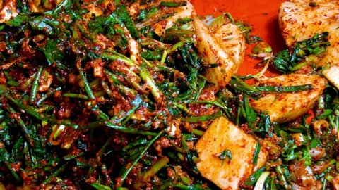 Korean food : Seokbakji. Seokbakji is a type of kimchi. Seokbakji is made of mixed radish and cabbage, which is made with medium leaves of cabbage, middle parts of radish, and various seafood.
