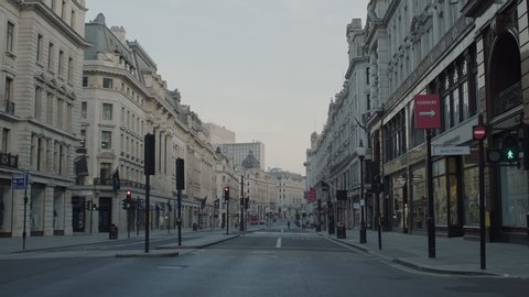 LONDON, ENGLAND, UK – April 14 2020: Lockdown London, Empty Regent street with all shops closed during coronavirus pandemic, no people