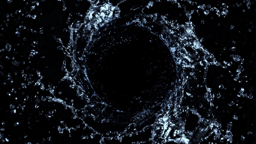 Super Slow Motion Shot of Rotating Water Splash Isolated on Black Background at 1000fps.