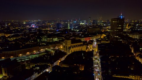 Brussels Belgium Aerial v1 Low vantage hyperlapse of downtown cityscape at night with people - November 2019