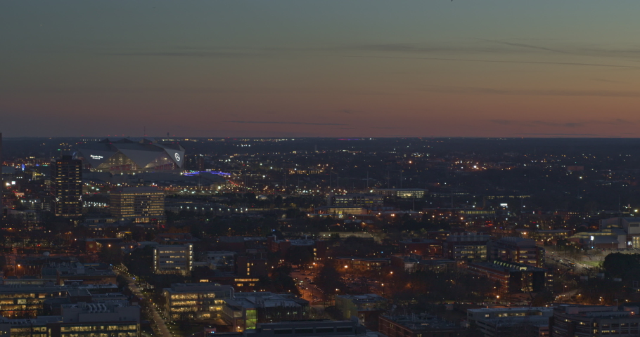 Atlanta Aerial v515 Slow panning cityscape from downtown to midtown at dusk night - January 2019