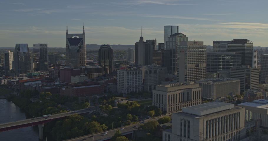 Nashville Tennessee Aerial v13 Panoramic view of downtown cityscape�s east side from near Justice Building to Pedestrian Bridge looking into sun - October 2018