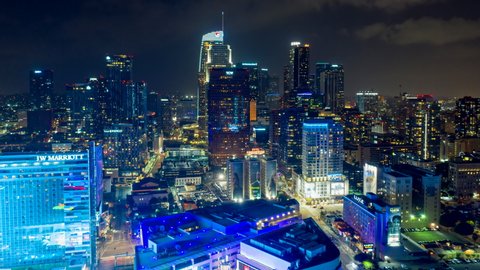 Los Angeles Aerial v250 Hyperlapse, ascending shot from blue lit South Park downtown district to wider cityscape at night with ominous sky - October 2019
