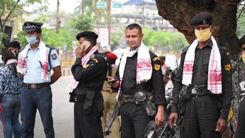 Guwahati, Assam, India. 15 April 2020. Assam police on duty wearing the traditional Assamese Gamosa as they celebrate Rongali Bihu, during the nationwide lockdown in wake of the coronavirus pandemic.