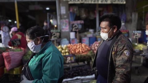 AREQUIPA, PERU - MARCH 31 2020. People walk in the market Andres Avelino Caceres looking for food during the quarantine in Peru because of the coronavirus (Covid-19).
