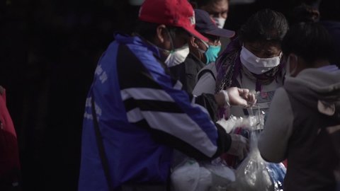 AREQUIPA, PERU - MARCH 31 2020. A street vendor offers face masks during the quarantine in Peru due to the coronavirus (Covid-19)