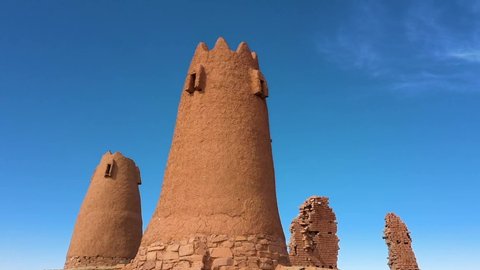 Drone footage of old Arabic sand castle and old tower in Saudi Arabia