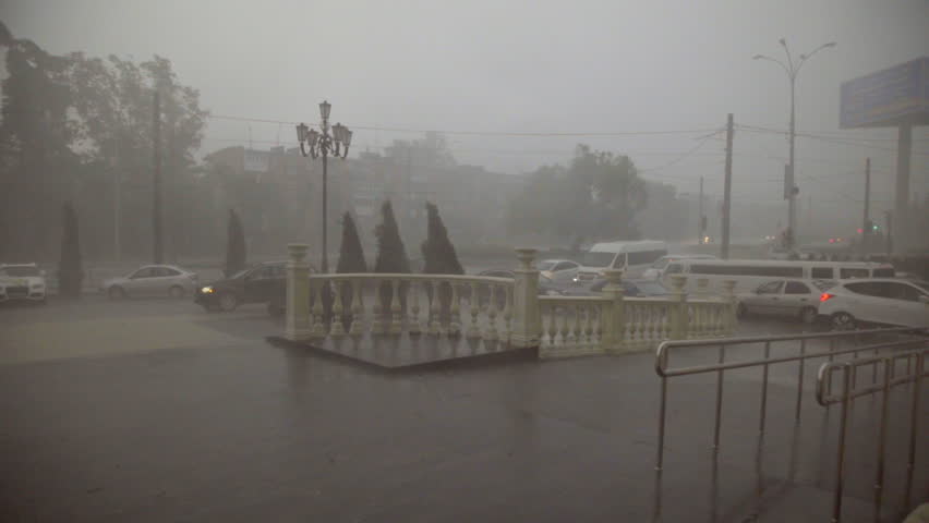 heavy rain and hail hit the city in the afternoon / Slow motion shot at 60 fps. You can  increase the speed to make 24 or 30 fps if you want