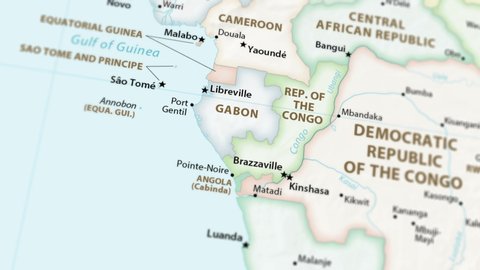 Gabon and the Republic of the Congo on a political map of the world. Video defocuses showing and hiding the map (4K UHD).