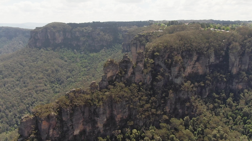 Panoramic Blue Mountains Australia. DRONE. Dramatic views of peaks, rock, valley, landscape, green rainforest jungle. Adventure, freedom, fun concepts. Tourist mountain trek. Shot in Sydney, NSW. Royalty-Free Stock Footage #1050583438