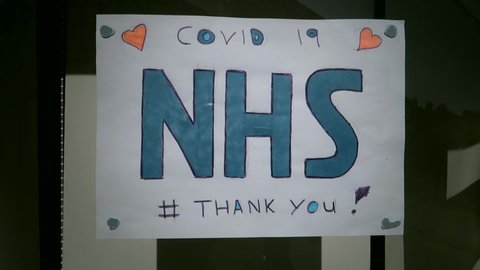 Corona virus.Thank you NHS kids drawings in shop window. Covid 19 pandemic lock down. Stay indoors, protect the NHS, save lives. Filmed East Yorkshire, England UK. 12/04/2020 