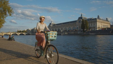 Attractive woman on a bicycle in Paris, France