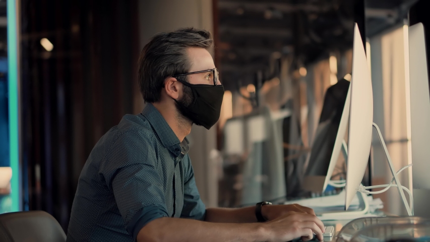 Man In Face Mask Office Workplace On Coronavirus Covid Epidemic. Remote Chatting Colleague Internet Online Meeting Conference Webinar.Distance Work Webcam.Businessman Texting In Face Mask Coronavirus  Royalty-Free Stock Footage #1050611338