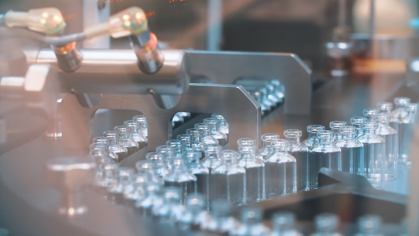 Glass medical bottles in pharmaceutical production for the production of vaccines and medical products. coronavirus.