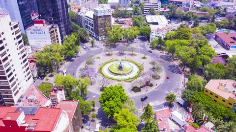 Mexico City - March 12, 2019: Aerial hyperlapse of the famous Cibeles fountain in the city center surrounded by restaurants